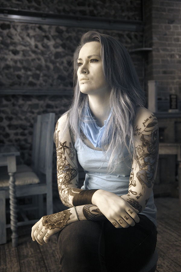 Infrared photograph of a girl with tattoos in the bar of The Red Lion Cromer