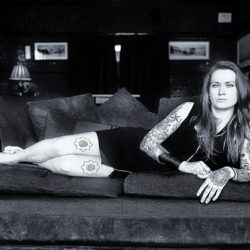 Black and white photograph of Tattoo Artist in The Red Lion Cromer