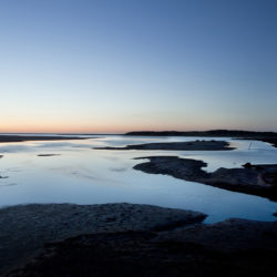 Photograph of incoming tide in the evening on Holkham sands.