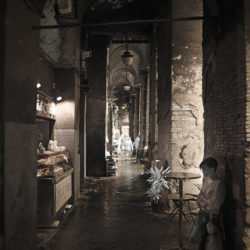 Photograph of a young girl in Genoa waiting.