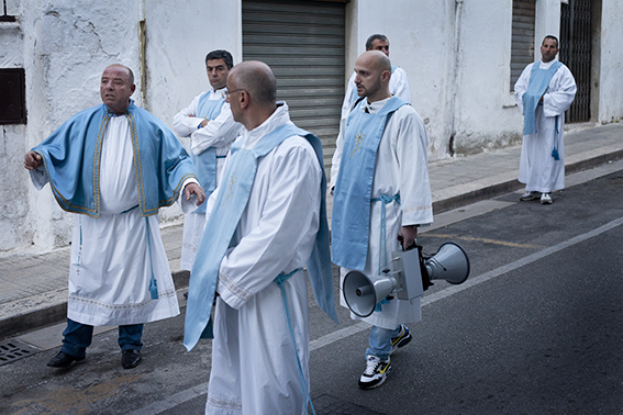 Photograph of priest with a megaphone Italy.