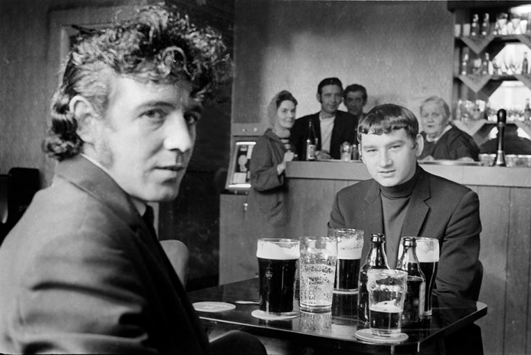 Black and white photograph of a two young trawlermen in a pub in Hull 1971.