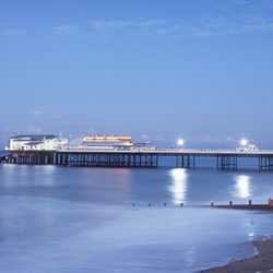 A photograph of Cromer pier at dusk.