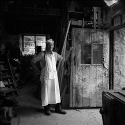 Black and white photograph of a carpenter and coffin maker.