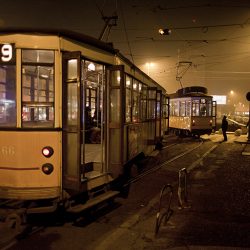 Photograph of a tram at night in Milan.