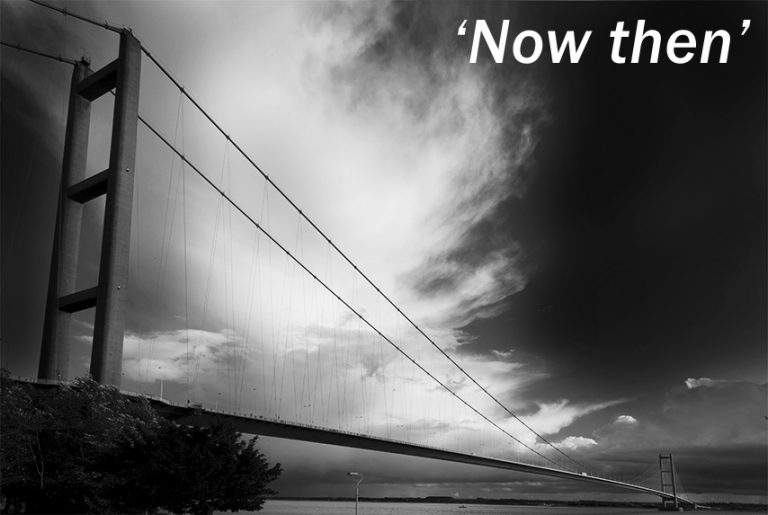 Black and white photograph of the Humber bridge with the title 'Now The'