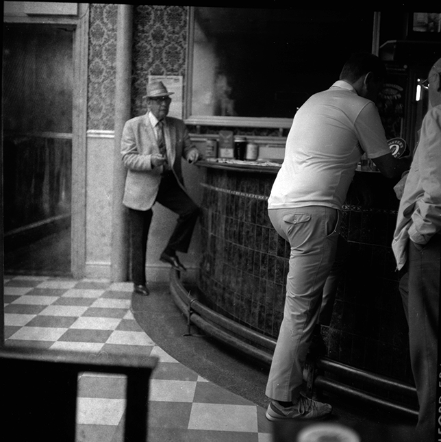 Black and white photograph of men at the bar in the King Billy pub Hull.