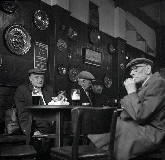 Black and white photograph of old men in the Theatre Tavern Hull.