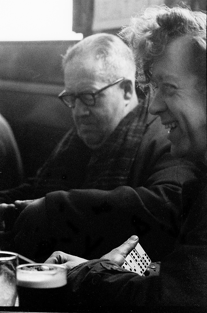 Black and white photograph of domino players in the Paragon pub Hull 1971.