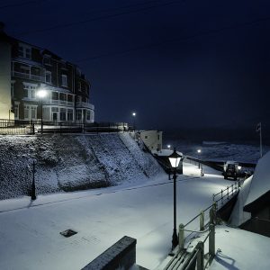 Colour photograph of snowfall on the Gangway Cromer just before dawn.