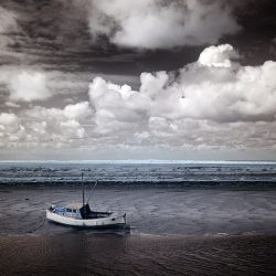 Infrared photograph of a boat on sandbanks Norfolk.