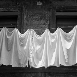 Black and white photograph of washing on a balcony in Spain.