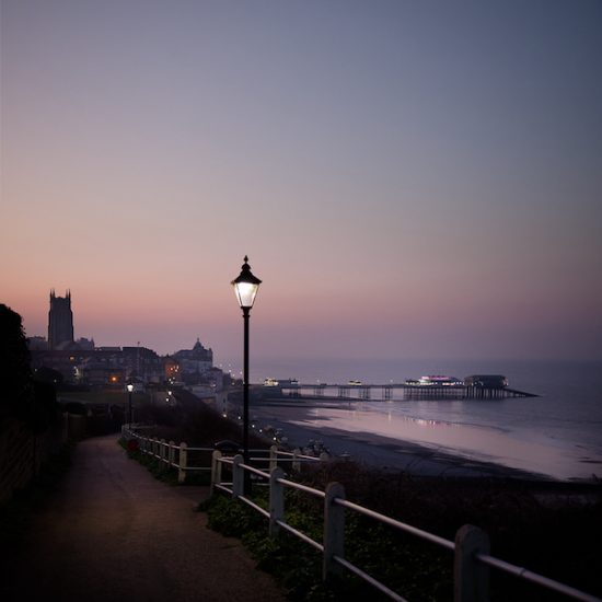 Moody evening image of Cromer in lamplight