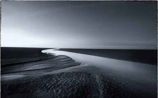 A tri-tone photograph of Holkham sands Norfolk.