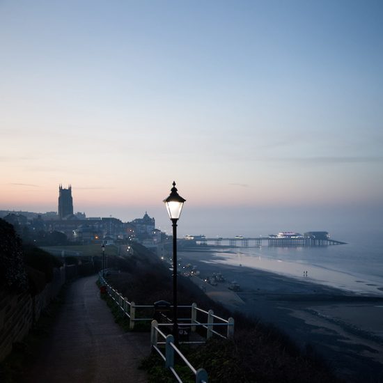 Moody evening image of Cromer in lamplight