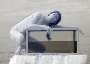 An infrared photograph of the dancer Louise Tanoto about to enter and aquarium on Cromer beach.